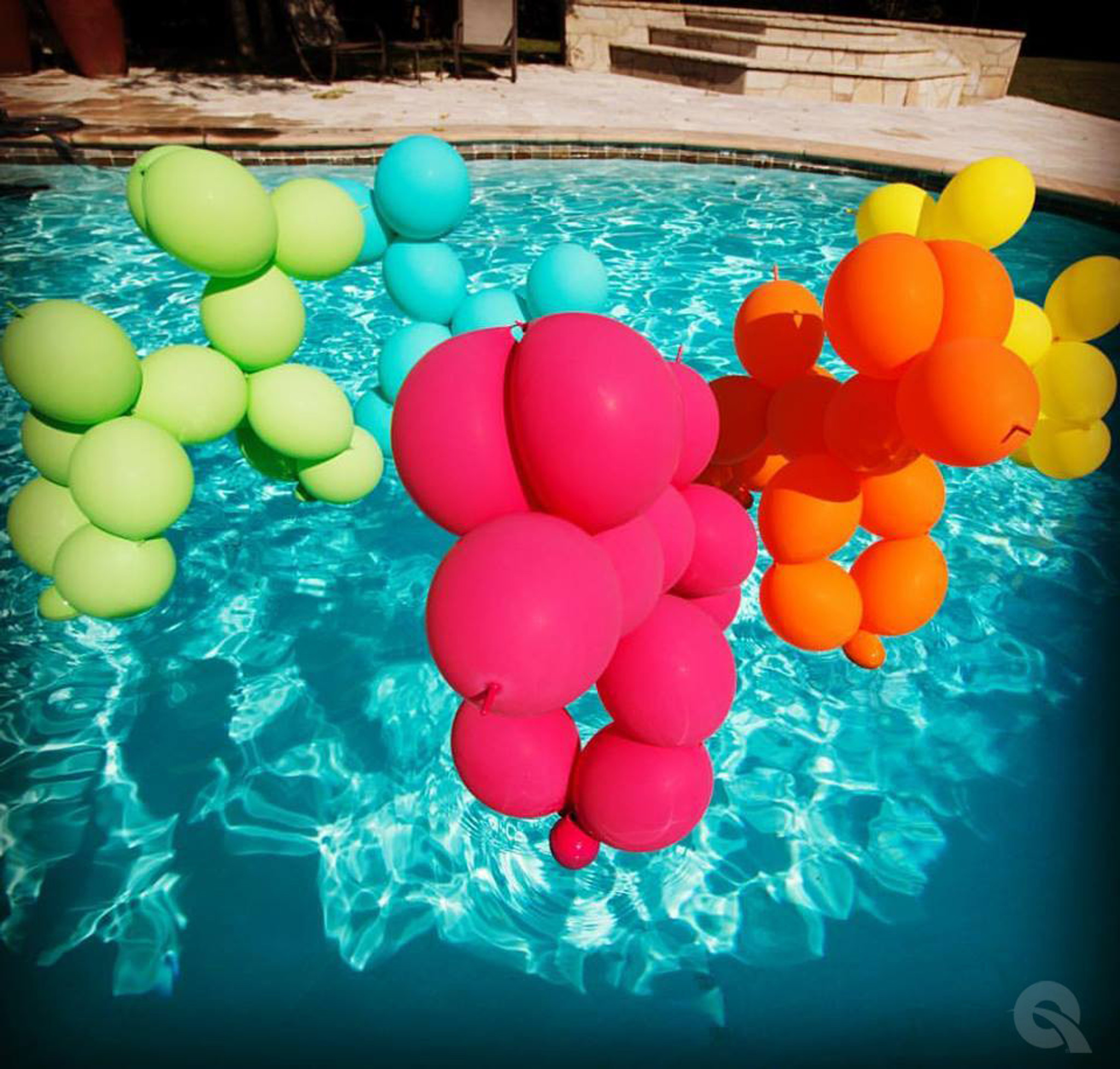 giant balloon animals floating in pool