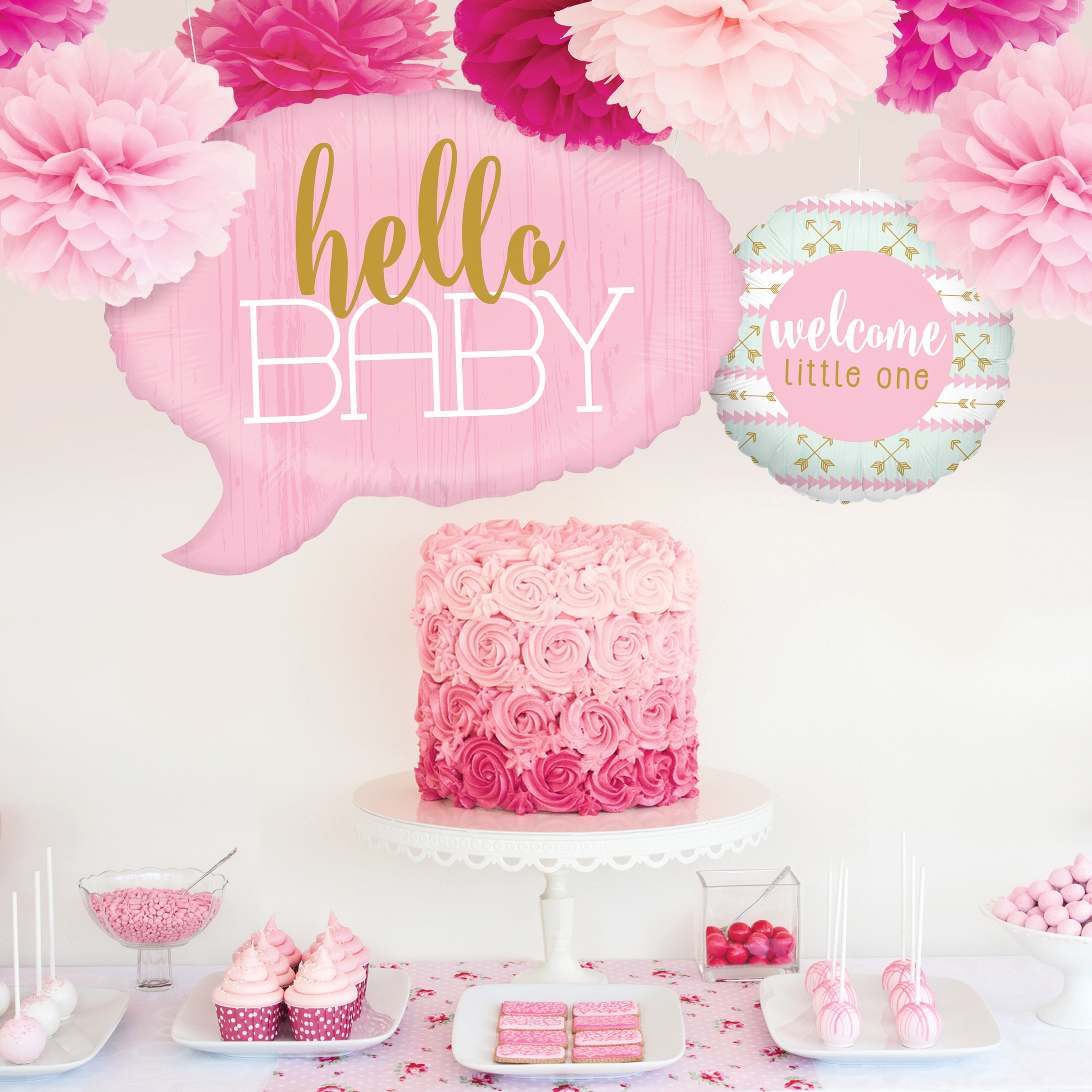 baby shower for girl with pink paper flower decorations